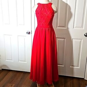Allure red gown size 8. Sheer overlay.  Lace at top open back.